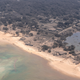Volcanic ash covers rooftops and vegetation in a photo taken Jan. 17, 2022, following a volcanic eruption in Tonga.